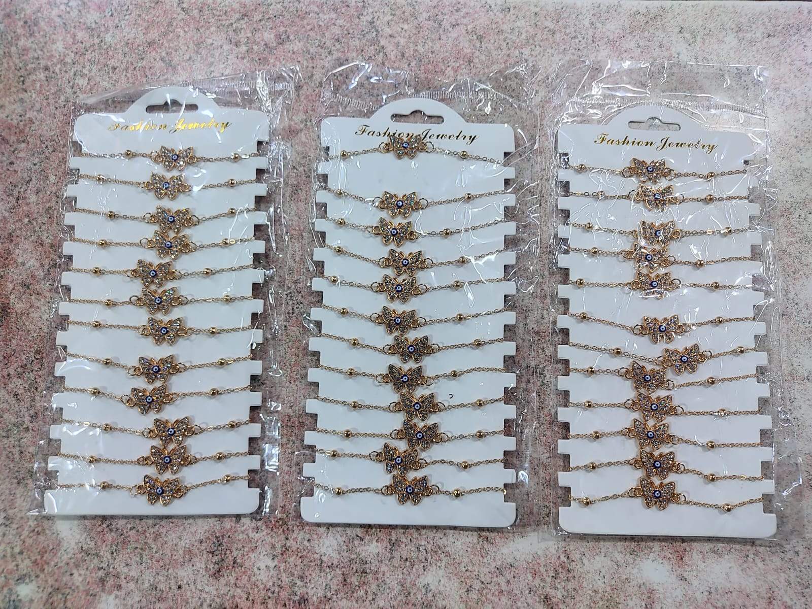 ✨ Pulsera de Metal Dorada con Ojo Turco y Dijes – Por Docena ✨